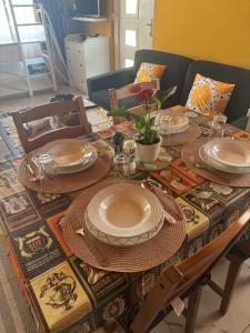 a table with plates and dishes on top of it at Cserke Nyaral-Lak in Cserkeszőlő