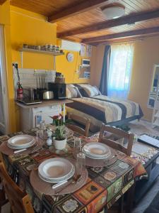 a room with a table with plates and a bed at Cserke Nyaral-Lak in Cserkeszőlő +17 photos