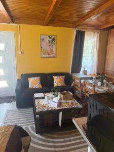a living room with a couch and a table at Cserke Nyaral-Lak in Cserkeszőlő