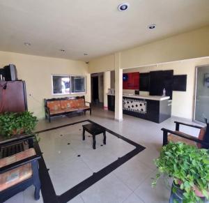 a living room with a couch and a table at Hotel Posada Aurorita in Villahermosa