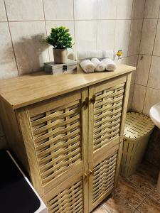 a bathroom with a wooden counter with wicker baskets at Casa Miniera in Linopótis +32 photos