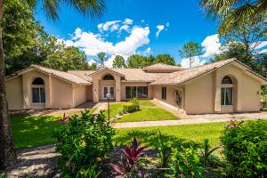 a house with a palm tree at SWISS 41 - Golf Course in Clermont