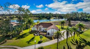 an aerial view of a house with a river at SWISS 56 - Lake Denise in Clermont