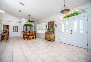a large living room with a table and a dining room at SWISS 56 - Lake Denise in Clermont