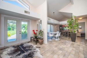 a living room with a kitchen and a dining room at SWISS 57 - Lake Denise in Clermont +19 photos