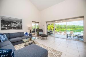 a living room with a couch and a table at SWISS 66 - Lake Denise in Clermont