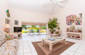 a living room with a couch and a coffee table at SWISS 61 - Lake Denise in Clermont +17 photos