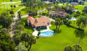 an aerial view of a house with a swimming pool at SWISS 30 - Golf Course in Clermont