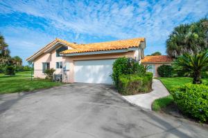 a house with a garage in front of it at SWISS 30 - Golf Course in Clermont +28 photos