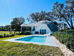 a house with a swimming pool in the yard at Sumner Lake House 2B in Clermont +29 photos