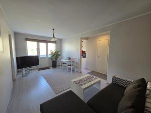 a living room with a couch and a table at Apartment Südalinnas in Haapsalu