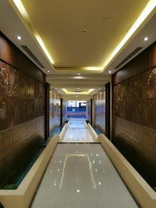 a hallway of a hotel with a hallway at ashbona suites in Riyadh