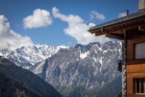 a view of a snow covered mountain range at 3BR Central Pool Sauna Gym & Views in Verbier