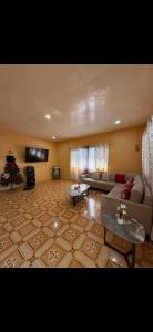 a living room with a couch and a christmas tree at Dorz Inn in Moalboal