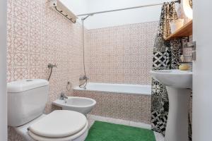 a bathroom with a toilet and a sink at Marine Freestyler Glorious Terrace in Faro +100 photos