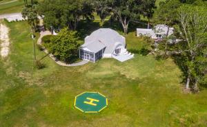 an overhead view of a house with a sign in the grass at Sumner Lake House 3B in Clermont +32 photos