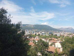a view of a city with mountains in the background at Appartement Fort Lamalgue in Toulon