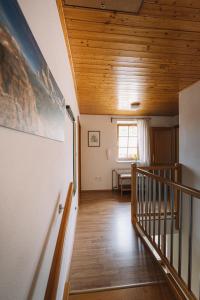 a hallway with a wooden ceiling and a staircase at Apartman Susilova Slavkov in Slavkov u Brna