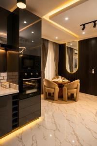 a kitchen and dining room with a table and chairs at The COZY CREST in Akure +89 photos