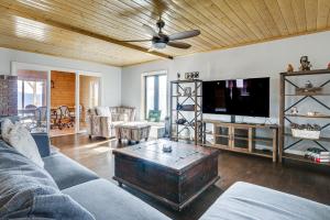 a living room with a couch and a flat screen tv at Hiking, Wineries & More! Mtn-View Gem in Tehachapi in Tehachapi