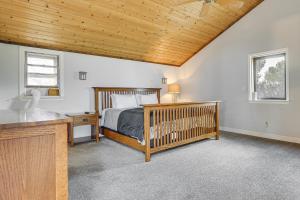a bedroom with a crib and a wooden ceiling at Hiking, Wineries & More! Mtn-View Gem in Tehachapi in Tehachapi +35 photos