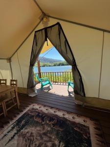 a tent with a view of the water at Emerald - Glamping tent in Klamath