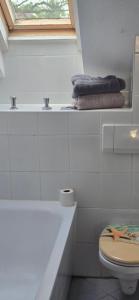 a bathroom with a toilet and a sink and towels at Gwuni's Farm in Geithain +31 photos