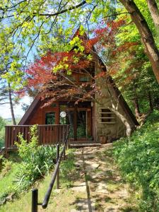 a log cabin with fall leaves on it at Chata Huslenky in Huslenky