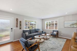 a living room with a couch and a table at The Eastman House in Santa Cruz