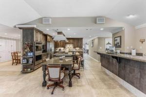 a large kitchen with a table and chairs in it at Escape at the SK in Huntsville