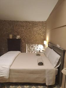 a bedroom with a large bed in a room at L'Era de Can Ribes Tor in Tor