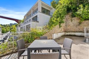 a table and chairs on a balcony with a building at Centerluxfirst in Luxembourg