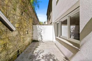 an alley between a building and a window at Centerluxfirst in Luxembourg +22 photos