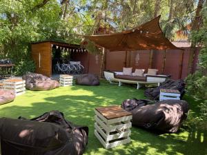 a backyard with a tent and a couch on the grass at Lake House Siófok in Siófok