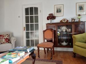 a living room with a chair and a coffee table at Conways B&B in Claremorris +27 photos