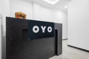 a sign with the ovo logo on a wall in a room at Super Hotel O Antilia in Gorakhpur