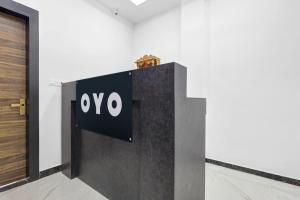 a sign on a wall next to a door at Super Hotel O Antilia in Gorakhpur +47 photos