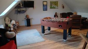 a living room with a large chess board on a table at Słoneczny Set in Wólka Klucka +40 photos
