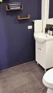 a bathroom with a white sink and a toilet at Sunset In Malabrigo in Puerto Chicama +21 photos