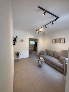 a living room with a couch and a table at Apartmani Tomaš in Tučepi