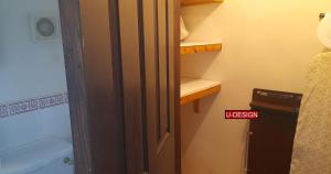 an open door to a small bathroom with a toilet at The Green Yard - Ebike Available for Guests in Sundon +65 photos