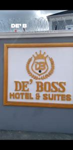 a sign for a dress hotel and suites at DE'BOSS hotels and suites in Okitipupa