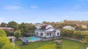 an aerial view of a house with a swimming pool at Luxury Haven Stay in Noida