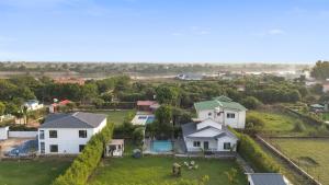 an aerial view of a house with a yard at Luxury Haven Stay in Noida