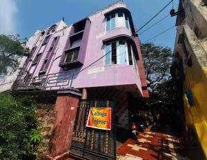 a building with a warning sign in front of it at Hotel O Kalinga Regency in Khandagiri