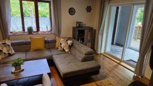a living room with a couch and a table at Chata Modesta in Děčín