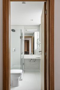 a bathroom with a toilet and a sink at Moov Hotel São Paulo in São Paulo +11 photos