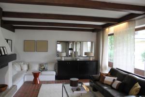 a living room with a couch and a table at Dorfchalet in Goldegg