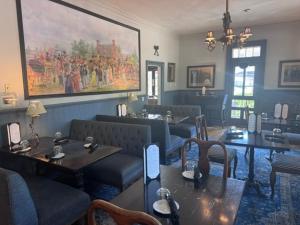 a restaurant with couches and tables in a room at The Little Inn in Bayfield