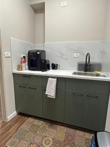 a kitchen with a sink and a counter top at Quiet Corner in Mafshatah